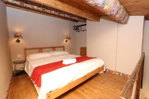 Postel nebo postele na pokoji v ubytování A timpa ro nannu - Appartamento 20