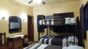 Postel nebo postele na pokoji v ubytování Posada Los Chaneques Catemaco