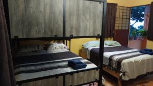 Postel nebo postele na pokoji v ubytování Posada Los Chaneques Catemaco