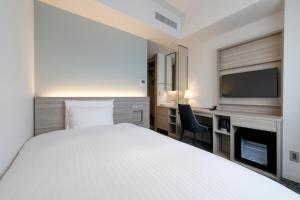 Postel nebo postele na pokoji v ubytování Glocal Hotel Itoshima