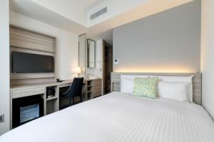 Postel nebo postele na pokoji v ubytování Glocal Hotel Itoshima