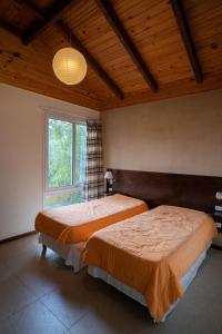 Postel nebo postele na pokoji v ubytování Entre Arboles Aparts