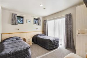 Postel nebo postele na pokoji v ubytování Kaikoura Gateway Motor Lodge + 26 fotografií
