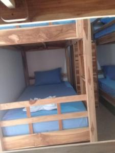 Postel nebo postele na pokoji v ubytování Turtle Island Homestay