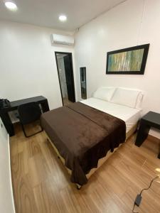 Postel nebo postele na pokoji v ubytování Apart Hotel Express