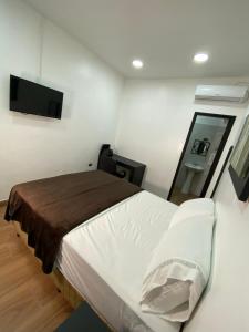 Postel nebo postele na pokoji v ubytování Apart Hotel Express