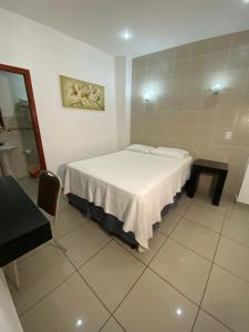 Postel nebo postele na pokoji v ubytování Apart Hotel Express