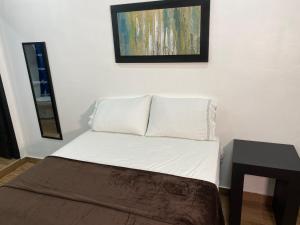 Postel nebo postele na pokoji v ubytování Apart Hotel Express