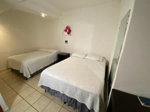 Postel nebo postele na pokoji v ubytování Apart Hotel Express