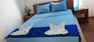 Postel nebo postele na pokoji v ubytování Turtle Island Homestay