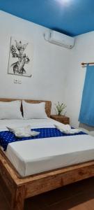 Postel nebo postele na pokoji v ubytování Turtle Island Homestay
