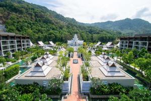 an aerial view of a resort with trees and buildings at InterContinental Phuket Resort by IHG in Kamala Beach