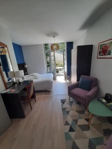 Ένα ή περισσότερα κρεβάτια σε δωμάτιο στο Hotel Régina