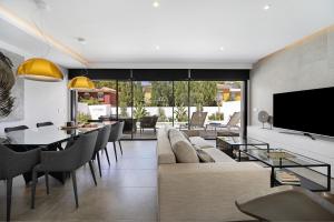 a living room with a couch and a table at Manuela Sea Villa in Chiclana de la Frontera