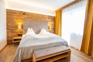 Łóżko lub łóżka w pokoju w obiekcie Apartment Bergsee