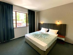 Posteľ alebo postele v izbe v ubytovaní Hotel Opal