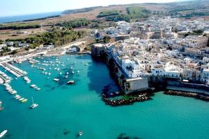 an aerial view of a harbor with boats in the water at Otranto selva del turchese in Otranto