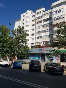 a group of cars parked in front of a building at Casa Nicolae in Brăila