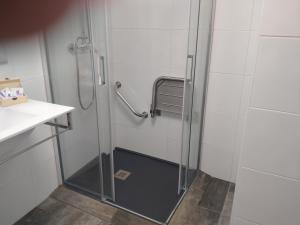 a shower with a glass door in a bathroom at Alojamientos Santa Pola in Santa Pola