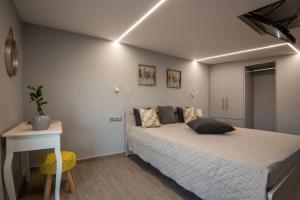 Ένα ή περισσότερα κρεβάτια σε δωμάτιο στο Mini Bella Gonia