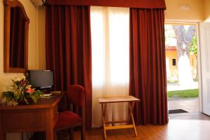 TV a/nebo společenská místnost v ubytování Hotel Dunas Puerto