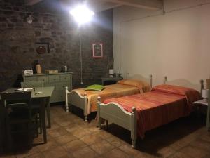 A bed or beds in a room at Il Rifugio di Bomar