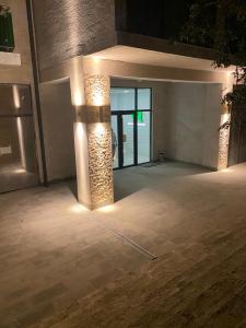an empty room with lights on the side of a building at Villa Residence Apartment in Tbilisi City +30 photos