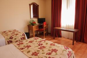 Postel nebo postele na pokoji v ubytování Hotel Dunas Puerto