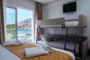 Postel nebo postele na pokoji v ubytování Minoa Hotel