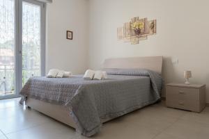 A bed or beds in a room at Casa Vacanza MariaTeresa