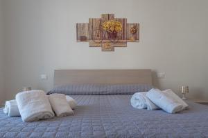 A bed or beds in a room at Casa Vacanza MariaTeresa