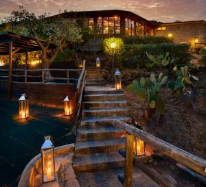 a set of stairs with lights in front of a building at Hotel Baia Imperiale in Campo nell'Elba