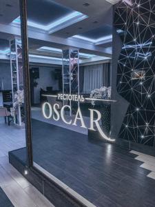 a store window with a sign that reads oscar at Рестотель Oscar in Kursk