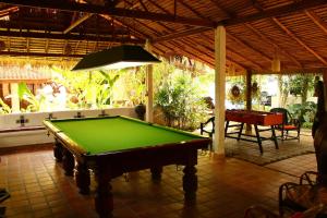 a pool table in the middle of a patio at Secret Garden Chiangmai in San Kamphaeng
