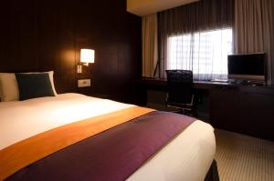 
A bed or beds in a room at Hotel Metropolitan Edmont Tokyo
