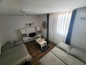 a living room with a couch and a table at Apartment Dada in Pula