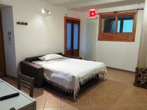 Ένα ή περισσότερα κρεβάτια σε δωμάτιο στο Casa Giorgio Mille Papaveri Rossi