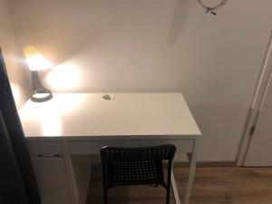 
a table with a lamp on top of it at Omega Apartments Budapest in Budapest
