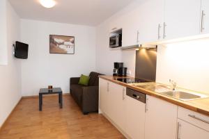 A kitchen or kitchenette at Apart welcom