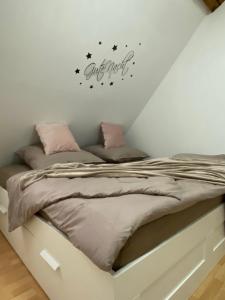 a bedroom with a bed with stars on the wall at FeWo Casa in Boizenburg