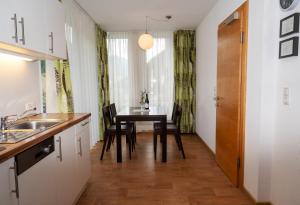 A kitchen or kitchenette at Apart welcom