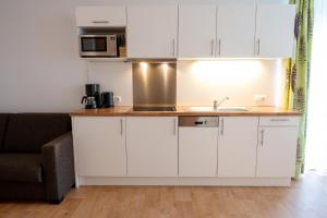 A kitchen or kitchenette at Apart welcom