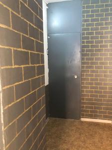 a door in a brick wall next to a brick wall at Devolano 1 in Odesa +11 photos