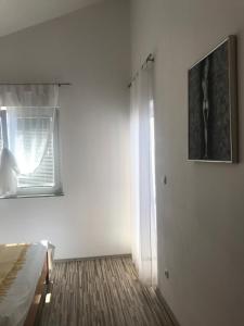 Postel nebo postele na pokoji v ubytování Apartmani Sanda i Leo
