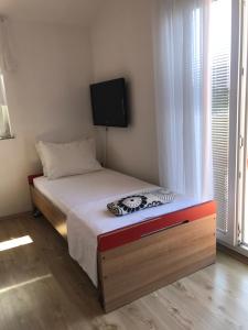 Postel nebo postele na pokoji v ubytování Apartmani Sanda i Leo