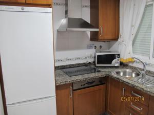 A kitchen or kitchenette at URBANIZACION EL ATARDECER