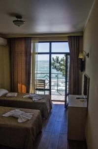 Postel nebo postele na pokoji v ubytování Hotel Medusa