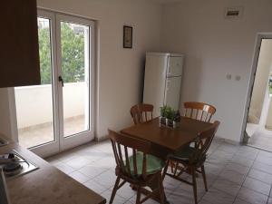 Kuchyň nebo kuchyňský kout v ubytování Anic Apartments Stanići