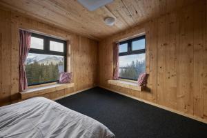 Postel nebo postele na pokoji v ubytování Jugendgästehaus Gerlosplatte