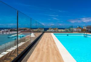 a swimming pool on the roof of a building at DWO Nopal in Puerto de la Cruz